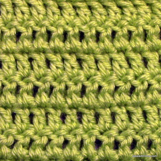Swatch of double crochet stitches in green.