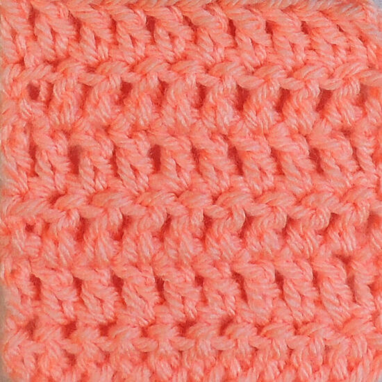 Swatch of double crochet stitches in pink.