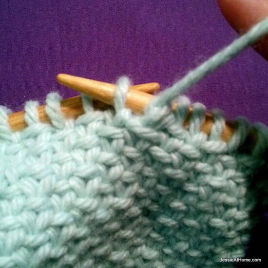 Photo showing step just explained of knit linen stitch.