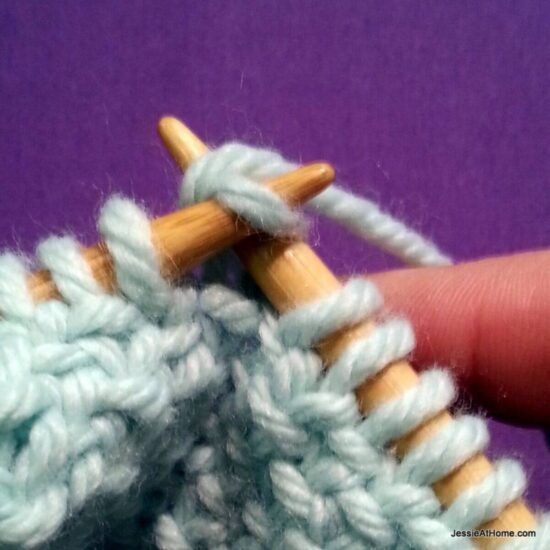 Photo showing step just explained of knit linen stitch.