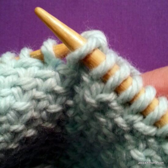 Photo showing step just explained of knit linen stitch.