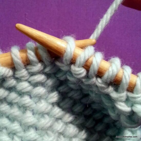 Photo showing step just explained of knit linen stitch.