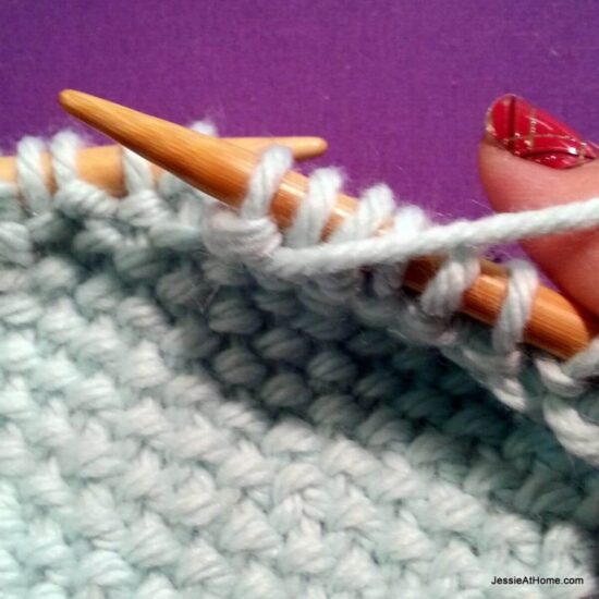 Photo showing step just explained of knit linen stitch.