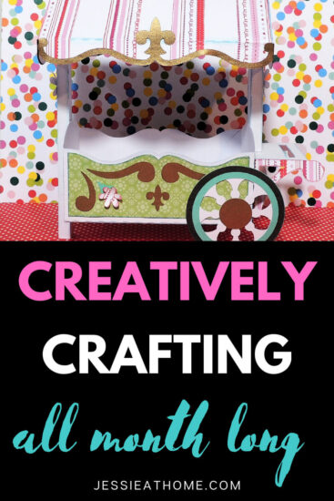 Image of a 3D paper flower cart above a black block with text which reads "creatively crafting all month long" and "Jessie At Home dot com"