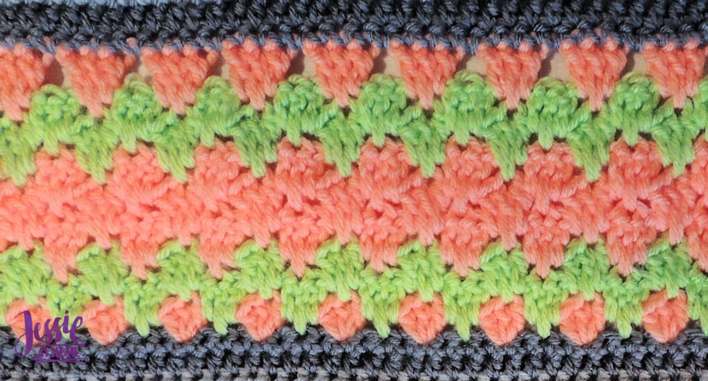 Salmon and light green crochet stitch pattern with gray on top and bottom.