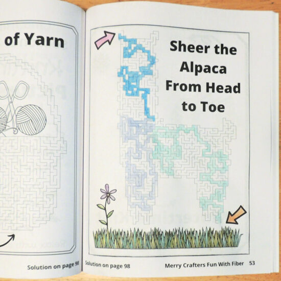 Photo of an activity book page. Page has an Alpaca shaped maze which has been solved with colored pencils.