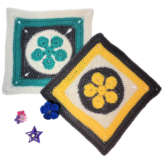 White square image, at top left is a crochet square with a teal 5 point flower in a white circle in the center, then a round of gray to make a square, followed by rounds in teal than white. At an angle off the bottom right corner is second square in yellow, gray and white. In the bottom left of the photo are red and blue stars and flowers.