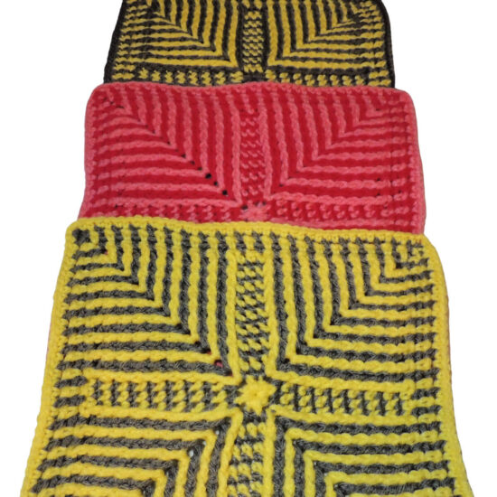 Three crochet squares, each covering the bottom half of the one before. All have angled stripes pointing in from corners made with post stitches. The first and last are gray and yellow and the middle is two tone pink.