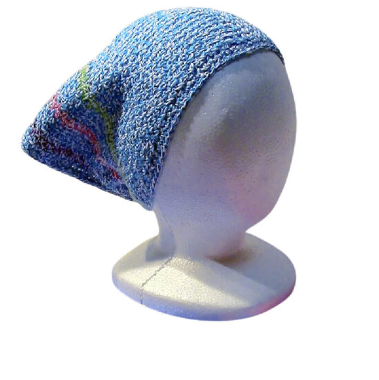 White Styrofoam head at an angle wearing a crochet triangular headscarf. The headscarf is light blue with 3 stripes close to the edge in green, pink, and purple.