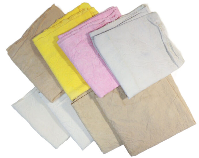 2 rows of 4 pieces 2 rows of 4 pieces of dyed and folded muslin. The top row is dark tan, yellow, pink, and very pale blue-gray. The bottom row is just a bit darker than muslin color, muslin color, tan, and medium tan.